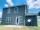 View of the exterior back of house with door, windows and satellite dish at 5908 Abbington Way, Raleigh, NC 27610