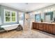 This luxurious bathroom includes double vanities, a tub, and a separate shower at 610 Bennett Mountain, Chapel Hill, NC 27516