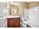 Cozy bathroom featuring a wood vanity, neutral walls and a shower-tub combo at 610 Bennett Mountain, Chapel Hill, NC 27516