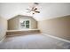 Carpeted bedroom featuring an attic-style ceiling, and a bright window with built-in storage at 610 Bennett Mountain, Chapel Hill, NC 27516