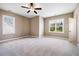 Bright and airy bedroom featuring two windows, neutral walls, and carpet flooring at 610 Bennett Mountain, Chapel Hill, NC 27516
