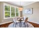 Cozy dining area with a round table, comfortable seating, and bright natural light at 610 Bennett Mountain, Chapel Hill, NC 27516
