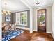 Elegant dining room featuring hardwood floors, a modern chandelier, and a view to the entry at 610 Bennett Mountain, Chapel Hill, NC 27516