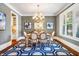 Elegant dining room with a chandelier, natural light, and views to the kitchen at 610 Bennett Mountain, Chapel Hill, NC 27516