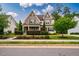 Charming two-story home showcasing a well-manicured front yard and a welcoming covered porch at 610 Bennett Mountain, Chapel Hill, NC 27516