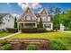 Charming two-story home with a beautifully landscaped front yard and stone accents at 610 Bennett Mountain, Chapel Hill, NC 27516