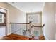 Upstairs hallway features hardwood floors and a decorative pendant light at 610 Bennett Mountain, Chapel Hill, NC 27516