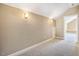 Upper hallway area featuring carpet flooring and neutral walls with decorative lighting fixtures at 610 Bennett Mountain, Chapel Hill, NC 27516