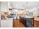 Well-equipped kitchen features stainless steel appliances, granite countertops, and hardwood floors at 610 Bennett Mountain, Chapel Hill, NC 27516