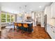 Modern kitchen featuring a large island, stainless steel appliances, and a breakfast nook at 610 Bennett Mountain, Chapel Hill, NC 27516