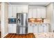 Modern kitchen features stainless steel appliances, tile backsplash and updated countertops at 610 Bennett Mountain, Chapel Hill, NC 27516