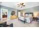 Spacious main bedroom featuring neutral walls, ceiling fan, and ensuite bathroom at 610 Bennett Mountain, Chapel Hill, NC 27516