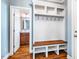 This convenient mudroom boasts built-in bench with storage and coat hooks at 610 Bennett Mountain, Chapel Hill, NC 27516