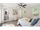Cozy bedroom with a ceiling fan, ample natural light, and ensuite bathroom at 6412 Forest Ridge Dr, Durham, NC 27713