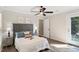 Inviting bedroom featuring a ceiling fan, and access to a private outdoor area at 6412 Forest Ridge Dr, Durham, NC 27713
