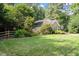 Attractive home boasting a lush green lawn and a lovely, fenced front yard at 6412 Forest Ridge Dr, Durham, NC 27713