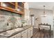 Bright kitchen featuring granite counters, stainless steel appliances, and decorative tile work at 6412 Forest Ridge Dr, Durham, NC 27713