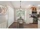 Eat in kitchen features stainless appliances, tile backsplash and barstool seating at 6412 Forest Ridge Dr, Durham, NC 27713