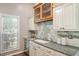 Charming kitchen features stainless steel appliances, granite countertops, and a window at 6412 Forest Ridge Dr, Durham, NC 27713