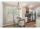 Eat in kitchen features stainless appliances, granite counters and breakfast area at 6412 Forest Ridge Dr, Durham, NC 27713