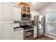 Bright kitchen features stainless steel appliances, granite countertops, and ample cabinetry at 6412 Forest Ridge Dr, Durham, NC 27713