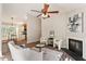 Living room with fireplace open to eat in kitchen with wood floors at 6412 Forest Ridge Dr, Durham, NC 27713