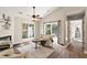 Bright and airy living room featuring vaulted ceilings, large windows, and hardwood floors at 6412 Forest Ridge Dr, Durham, NC 27713