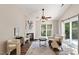 Inviting living room with a fireplace, sliding glass doors and neutral furniture at 6412 Forest Ridge Dr, Durham, NC 27713