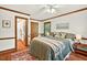 Charming bedroom with hardwood floors, decorative trim, and ensuite bathroom access for convenience at 6728 Glen Forrest Dr, Chapel Hill, NC 27517