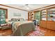Comfortable bedroom boasts built-in shelving and storage, providing a cozy and organized space at 6728 Glen Forrest Dr, Chapel Hill, NC 27517