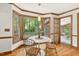 Eat-in kitchen breakfast nook with hardwood floors and views of backyard at 6728 Glen Forrest Dr, Chapel Hill, NC 27517