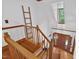 Bright foyer features hardwood floors, a wooden staircase, and natural light cascading from above at 6728 Glen Forrest Dr, Chapel Hill, NC 27517