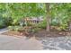 Charming two-story home with red siding, white trim, and mature trees in a landscaped yard at 6728 Glen Forrest Dr, Chapel Hill, NC 27517