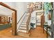 Spacious foyer featuring hardwood floors, a staircase, and elegant trim details at 6728 Glen Forrest Dr, Chapel Hill, NC 27517