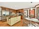 Bright eat-in kitchen features stainless steel appliances and hardwood flooring at 6728 Glen Forrest Dr, Chapel Hill, NC 27517