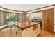 Kitchen features an island, eat-in nook, laundry room, and hardwood floors at 6728 Glen Forrest Dr, Chapel Hill, NC 27517