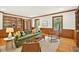 Warm and inviting living room with hardwood floors, built-in bookshelves, and natural light at 6728 Glen Forrest Dr, Chapel Hill, NC 27517