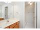 The bathroom features a vanity, mirror, and separate shower and tub, offering style and function at 8512 Barrett Hall Ln, Wake Forest, NC 27587