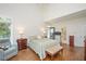 Spacious bedroom featuring hardwood floors, lots of natural light and neutral colors at 8512 Barrett Hall Ln, Wake Forest, NC 27587