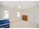This spacious bedroom features natural light from two windows, a ceiling fan, and closet at 8512 Barrett Hall Ln, Wake Forest, NC 27587