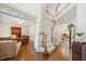 Bright foyer with staircase and hardwood floors throughout at 8512 Barrett Hall Ln, Wake Forest, NC 27587