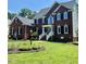 Beautiful two-story brick home with a well-manicured lawn and inviting front entrance at 8512 Barrett Hall Ln, Wake Forest, NC 27587