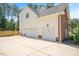 Spacious three car garage and concrete parking pad at 8512 Barrett Hall Ln, Wake Forest, NC 27587