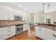 Modern kitchen featuring stainless steel appliances and hardwood floors at 8512 Barrett Hall Ln, Wake Forest, NC 27587