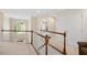Bright open landing featuring wood banister and lots of natural light at 8512 Barrett Hall Ln, Wake Forest, NC 27587