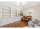 Elegant living room featuring custom built-in bookshelves at 8512 Barrett Hall Ln, Wake Forest, NC 27587