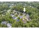 An aerial view of a home nestled within a leafy neighborhood offering a serene and picturesque setting at 9 Monteith Ct, Durham, NC 27713