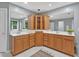 Spacious bathroom with dual sinks, and wood cabinets offering ample storage space at 9 Monteith Ct, Durham, NC 27713