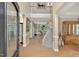 Elegant foyer with hardwood floors, staircase, and soaring ceilings creating an inviting entrance at 9 Monteith Ct, Durham, NC 27713