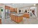 Spacious kitchen featuring an island, stainless steel appliances, and tile flooring at 9 Monteith Ct, Durham, NC 27713